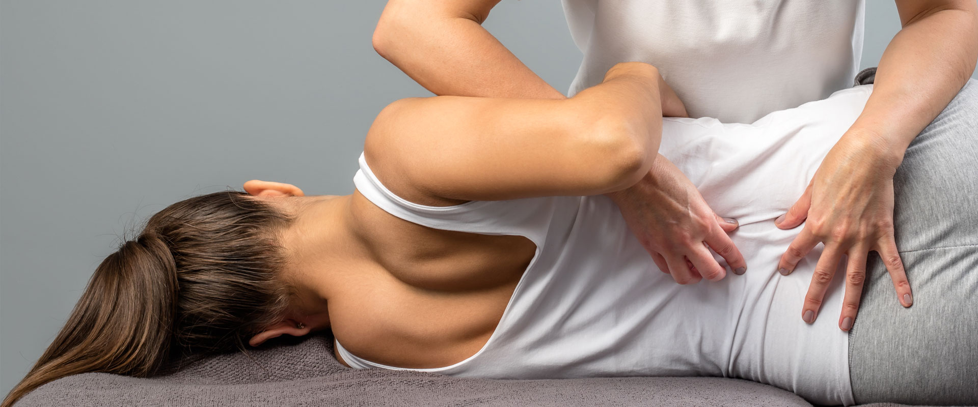 Woman receiving low back pain treatment in Edmonton